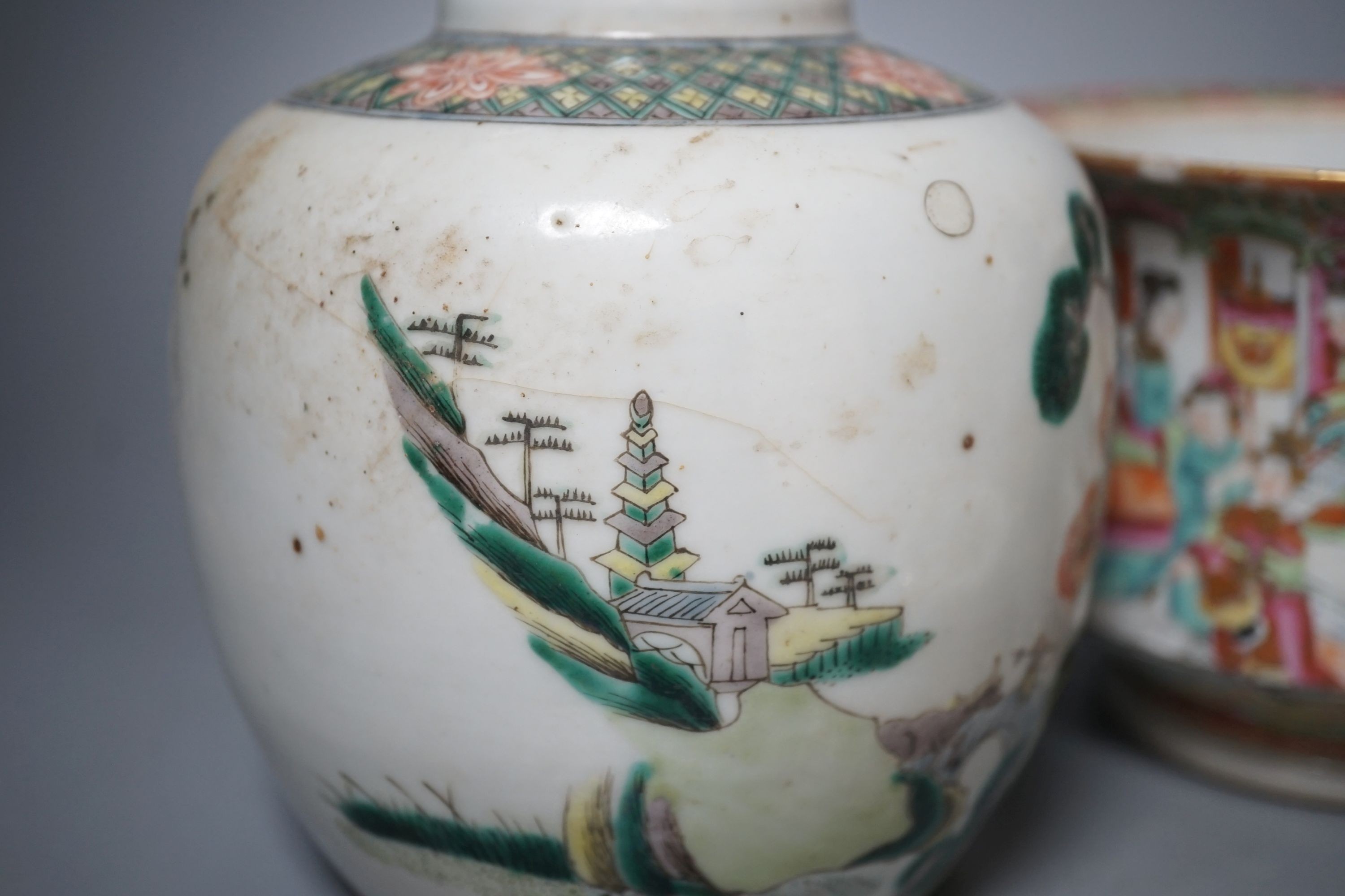 A group of 19th-century Chinese enamelled porcelain vessels, to include a jar, a pair of hexagonal vases, a pot and a cricket cage, Pair of vases 22cm high.